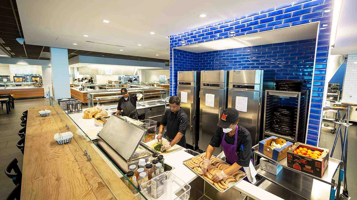 Cooks Shelton Harrington (left), Ekramul Huq and Christina Brackins prep meals in Yahentamitsi, UMD’s first new dining hall in nearly 50 years.